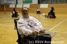 E-Rolli Fahrer am Spielfeldrand