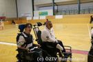 E-Rolli Fahrer am Spielfeldrand